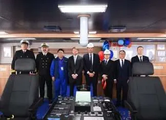ADNOC L&S takes early delivery of new LNG carrier Keith Mander, Manager of Marine Projects at ADNOC Logistics & Services (fourth from left), with crew members, and representatives from Jiangnan Shipyard, at the delivery of Arada