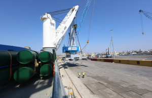 One of the new mobile harbour cranes being offloaded at the port of Tartous in Syria