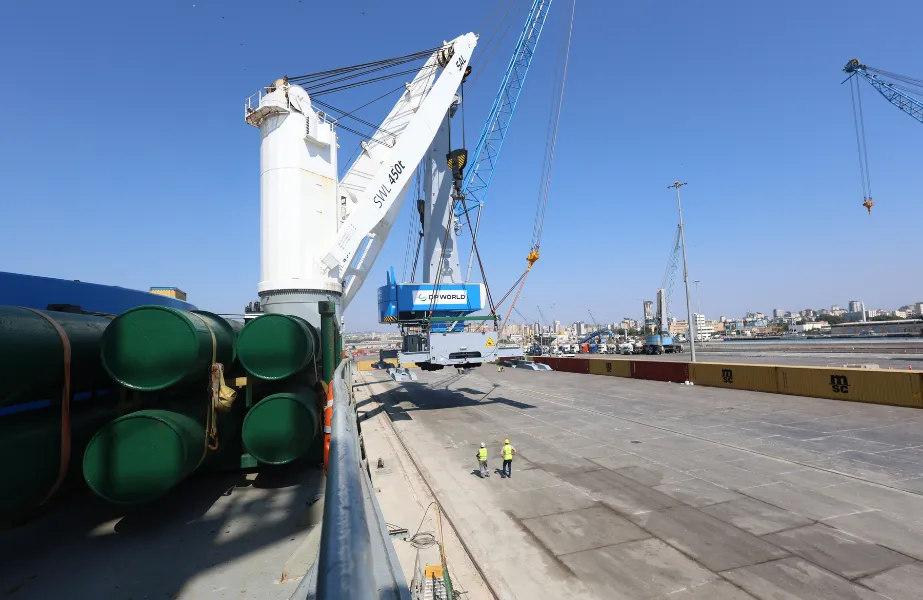 One of the new mobile harbour cranes being offloaded at the port of Tartous in Syria