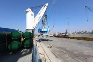 One of the new mobile harbour cranes being offloaded at the port of Tartous in Syria